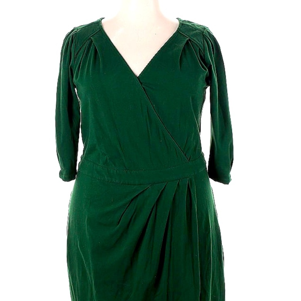 Beautiful green faux wrap dress with ruching detail.